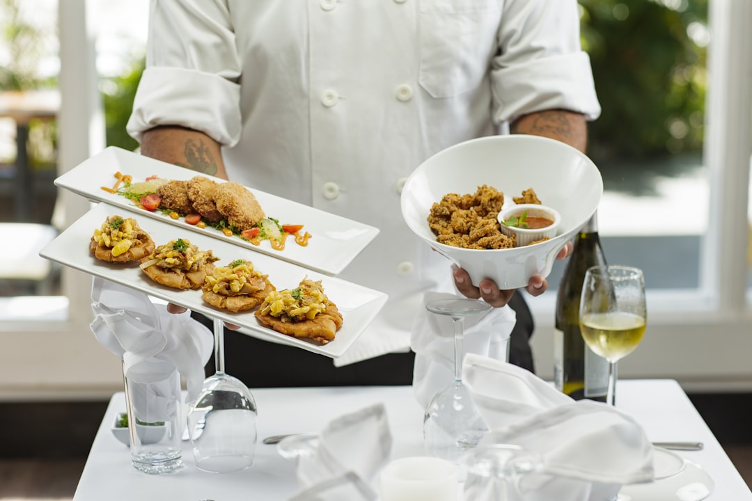 person-in-white-dress-shirt-holding-white-ceramic-bowl-with-food-97qhpswnnce